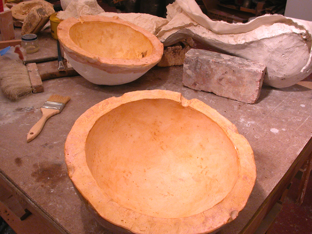 Shell Game. 2005. Artist’s blood, lead, resin. 68 x 120 x 48" (dimensions variable). Prepped ball molds. Darrin Hallowell