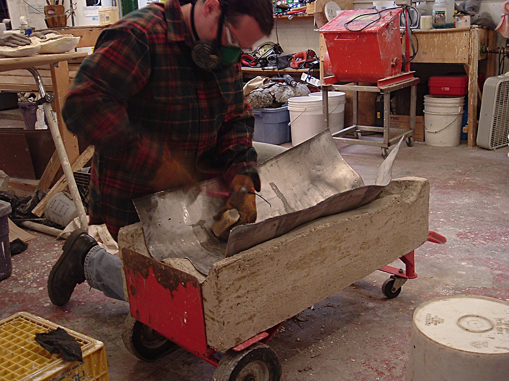 Recall, Shell Game. 2005. Mixed media. Dimensions variable. Lead being formed into mold. Darrin Hallowell