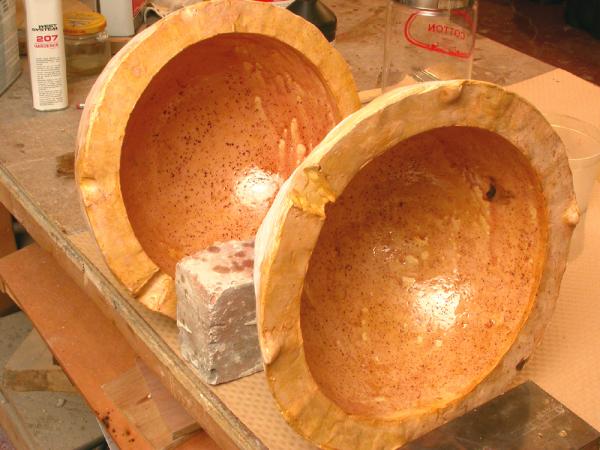 Shell Game. 2005. Artist’s blood, lead, resin. 68 x 120 x 48" (dimensions variable). Molds with first layers of blood. Darrin Hallowell